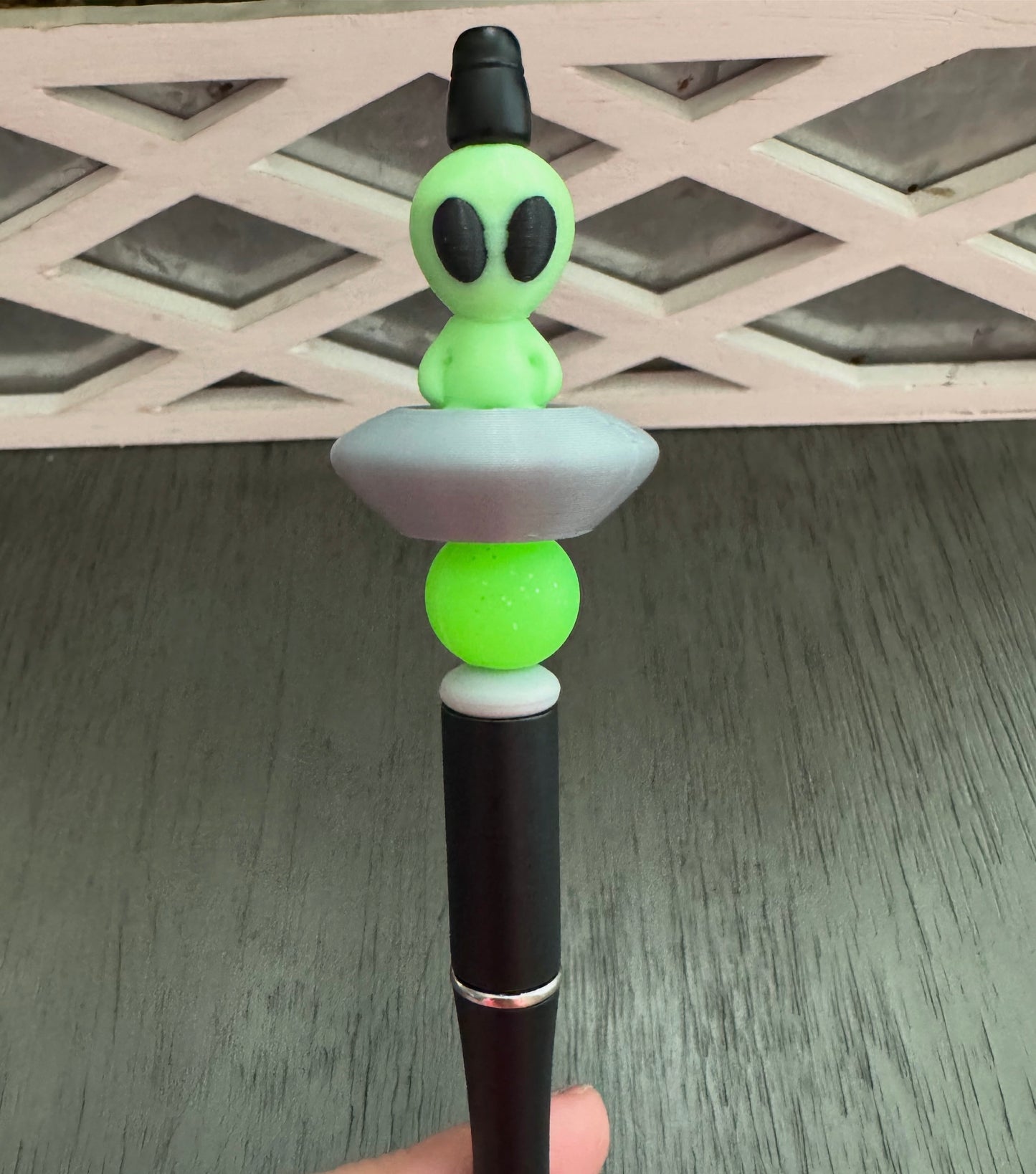 Green Alien in Space Ship