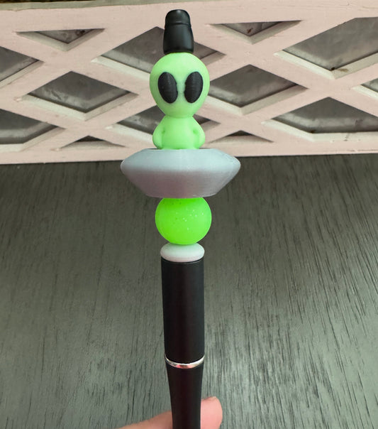 Green Alien in Space Ship